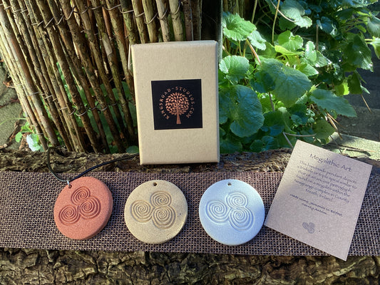 Megalithic Art Pendant with Triskele Design.