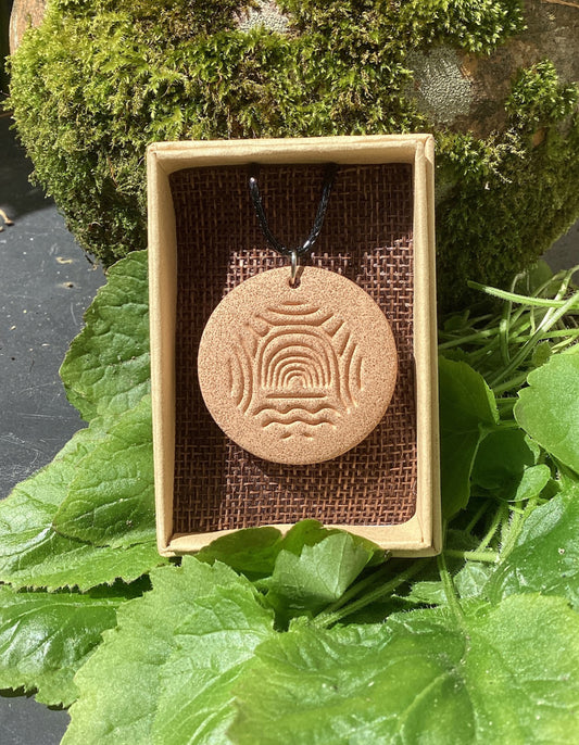 Megalithic Art Pendant with Portal Design.