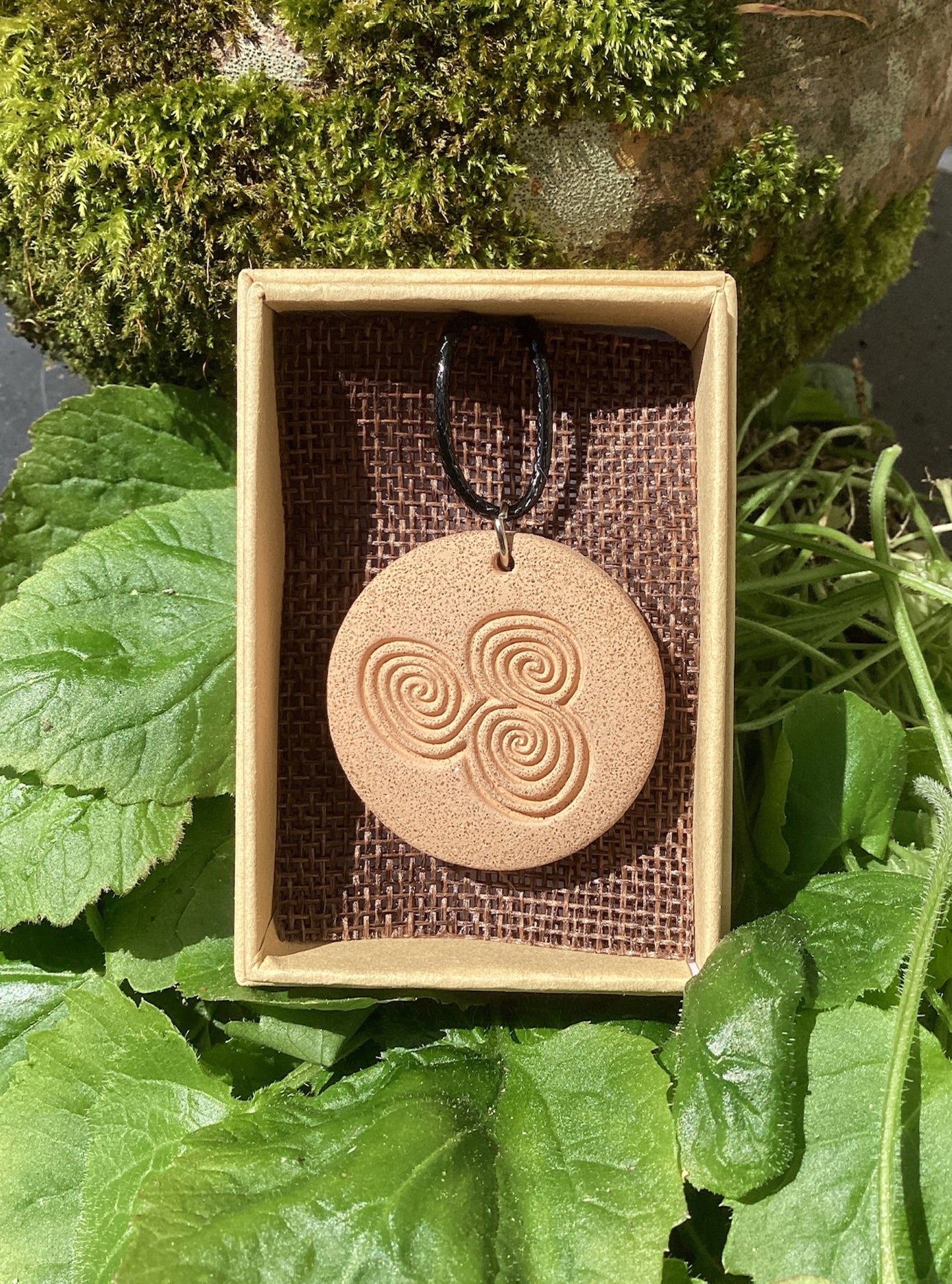 Megalithic Art Pendant with Triskele Design.