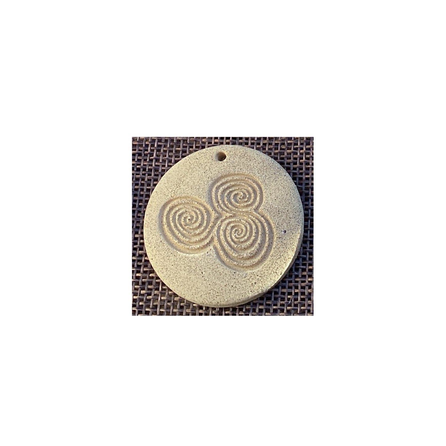 Megalithic Art Pendant with Triskele Design.
